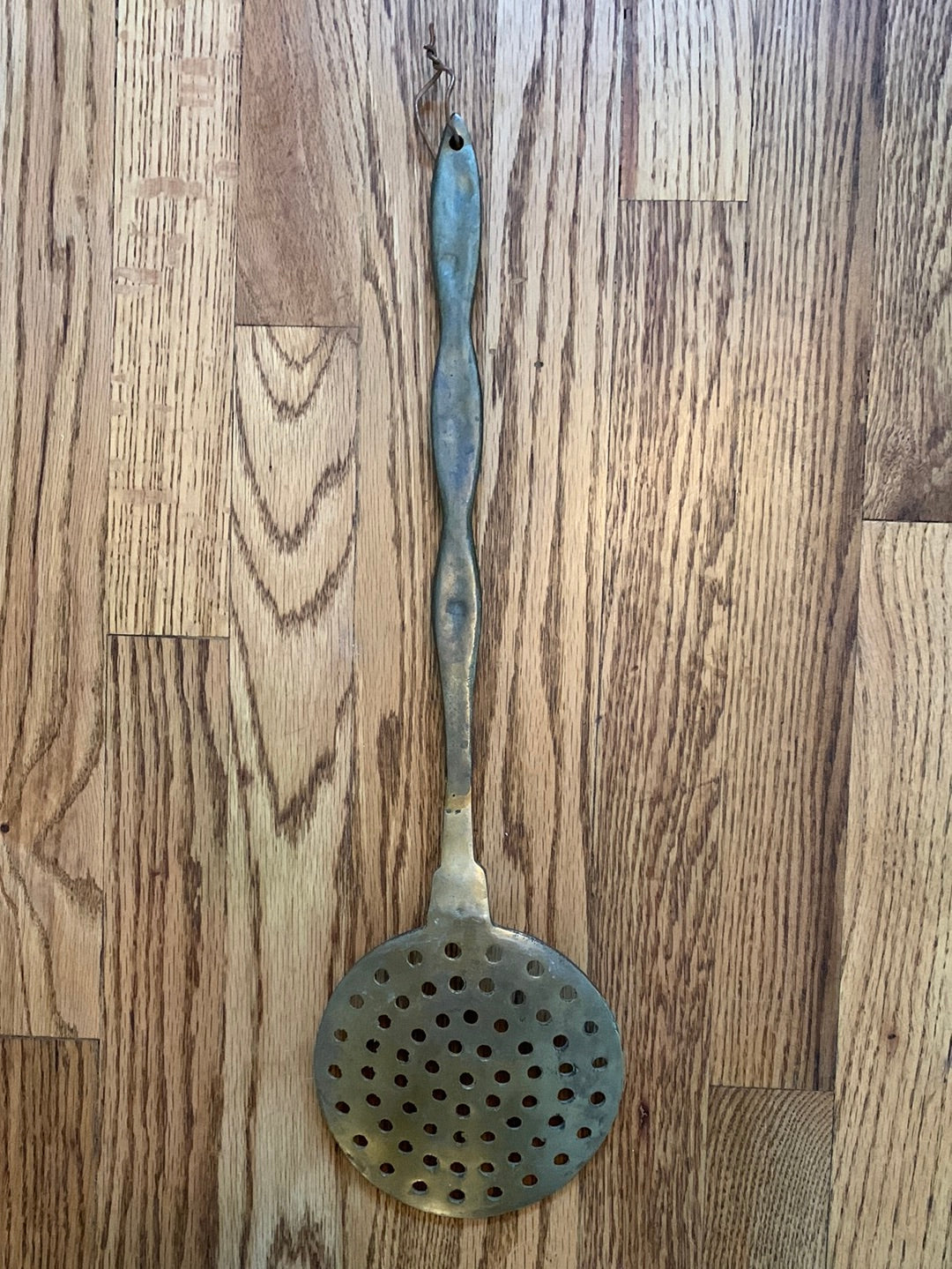 Large metal slotted spoon