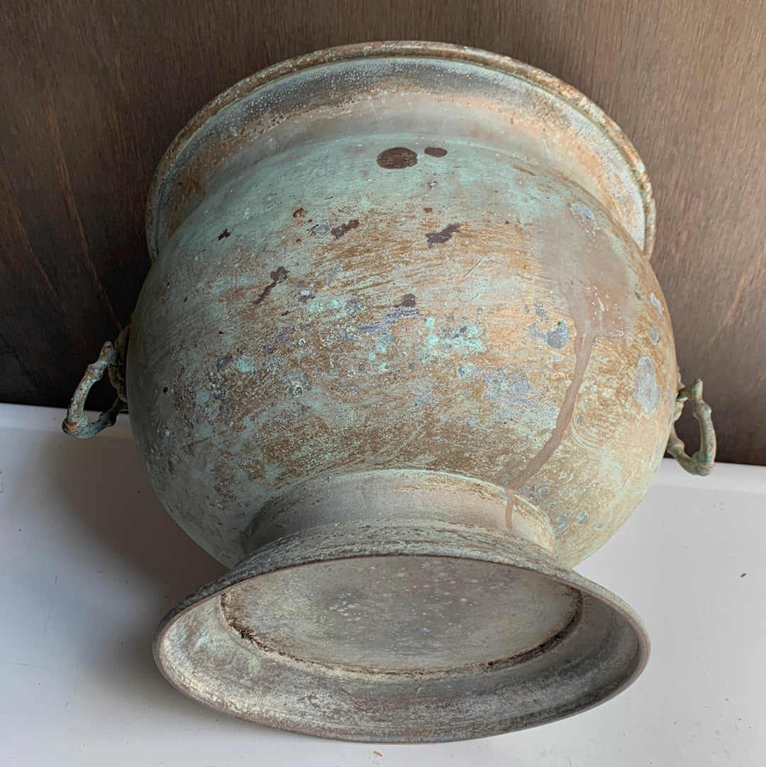 Metal planter with lion handles