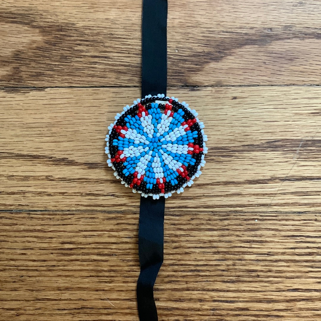 Seed bead medallion on black ribbon