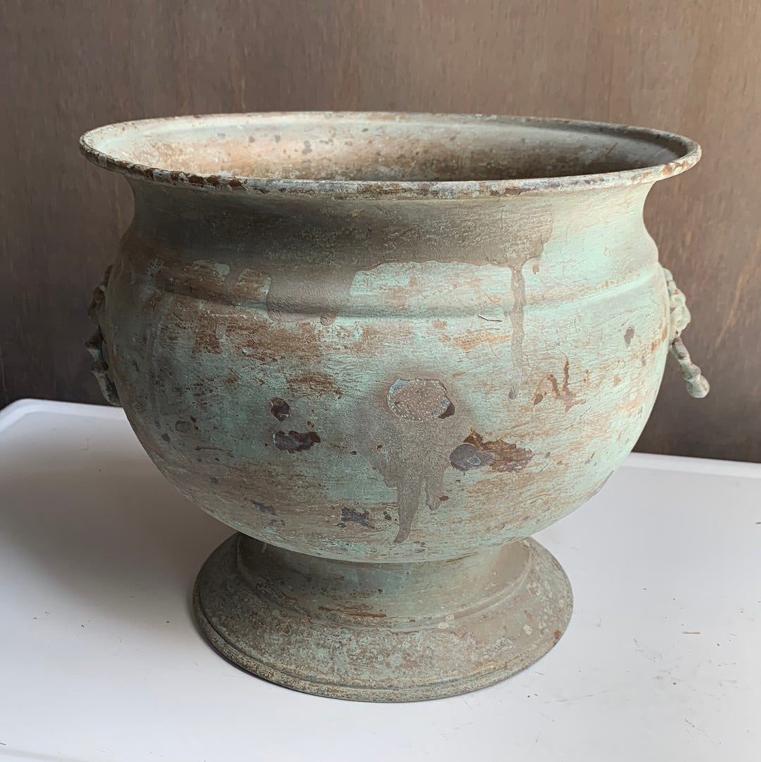 Metal planter with lion handles