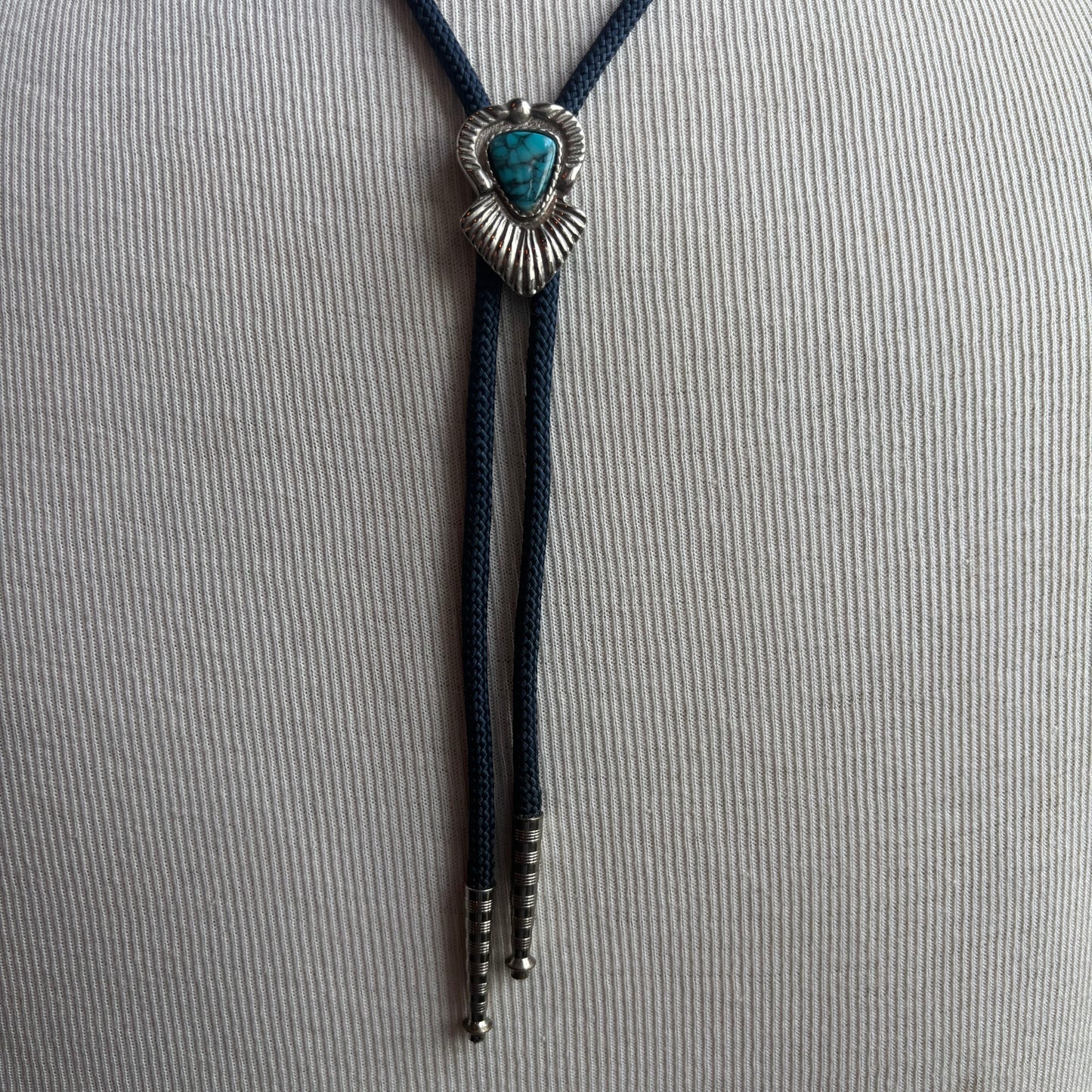 Blue Stone Bolo on Blue Tie