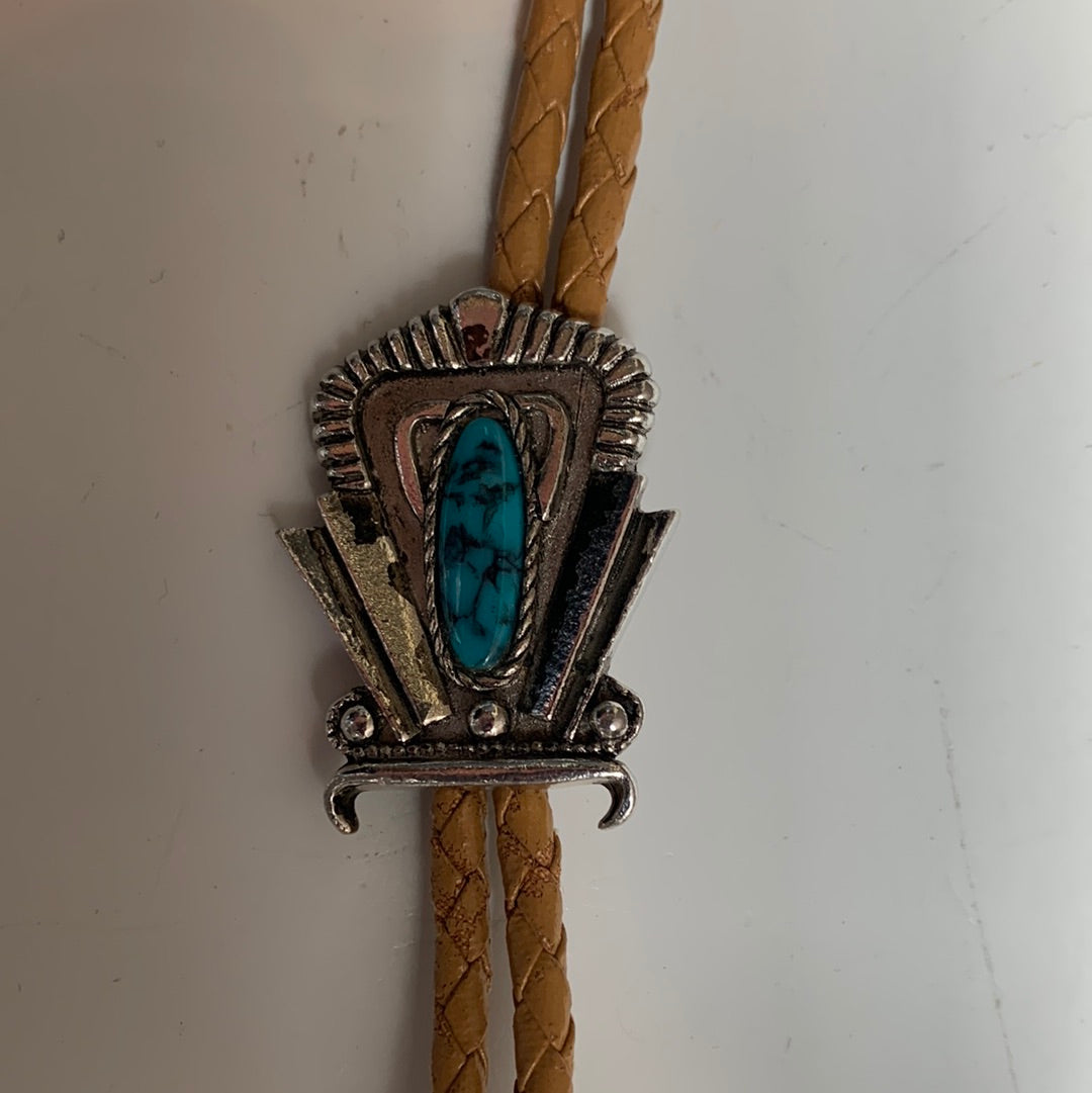 Silver decorative bolo with stone and tan leather cord