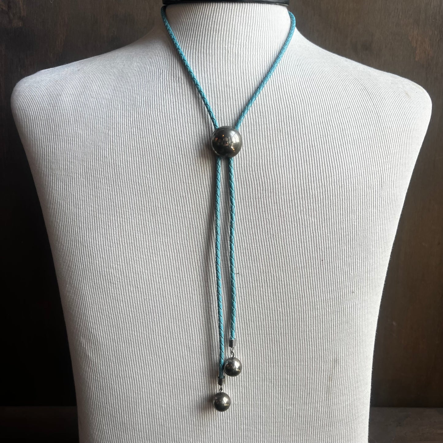 Silver Circle Bolo on Blue Cord