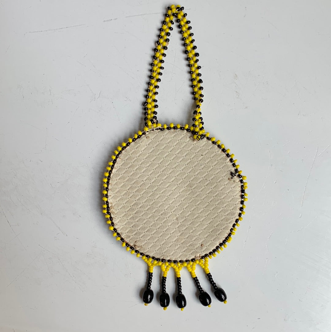 Yellow and black seed bead sun medallion