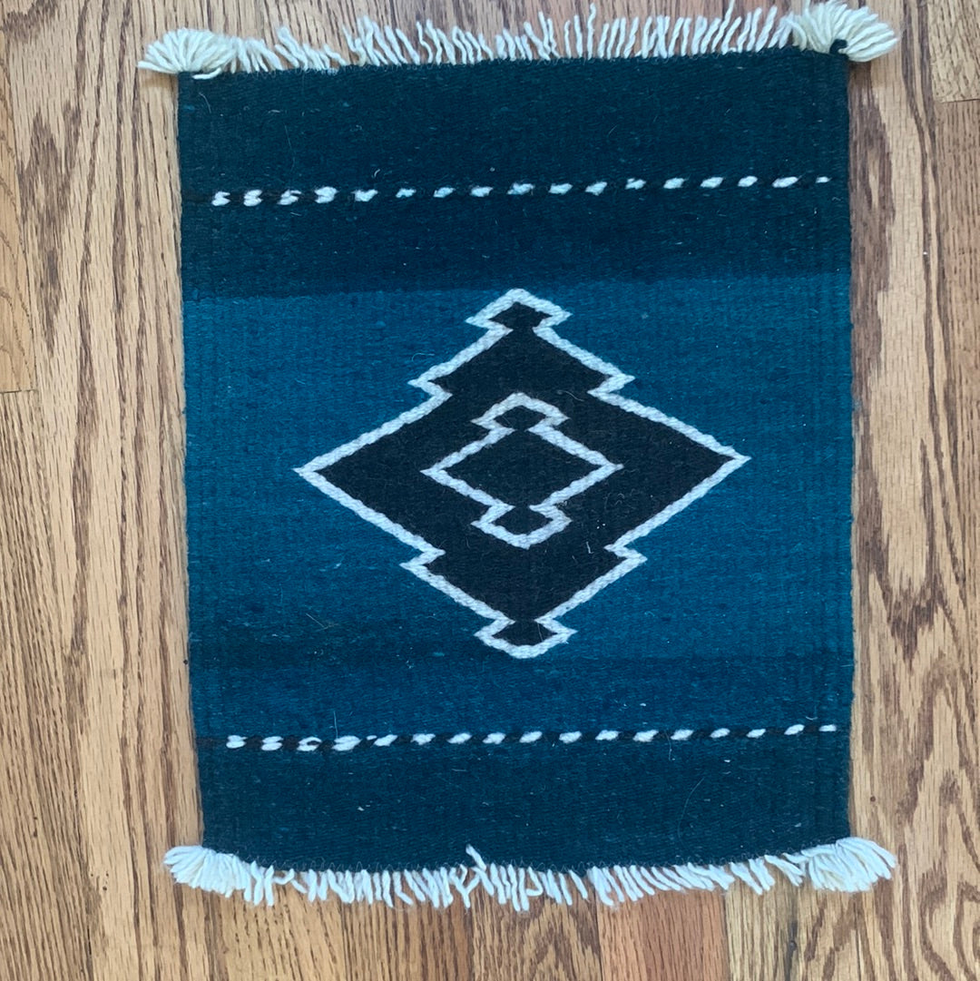 Teal, black & cream weaving