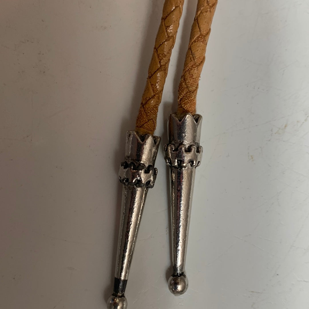 Silver decorative bolo with stone and tan leather cord