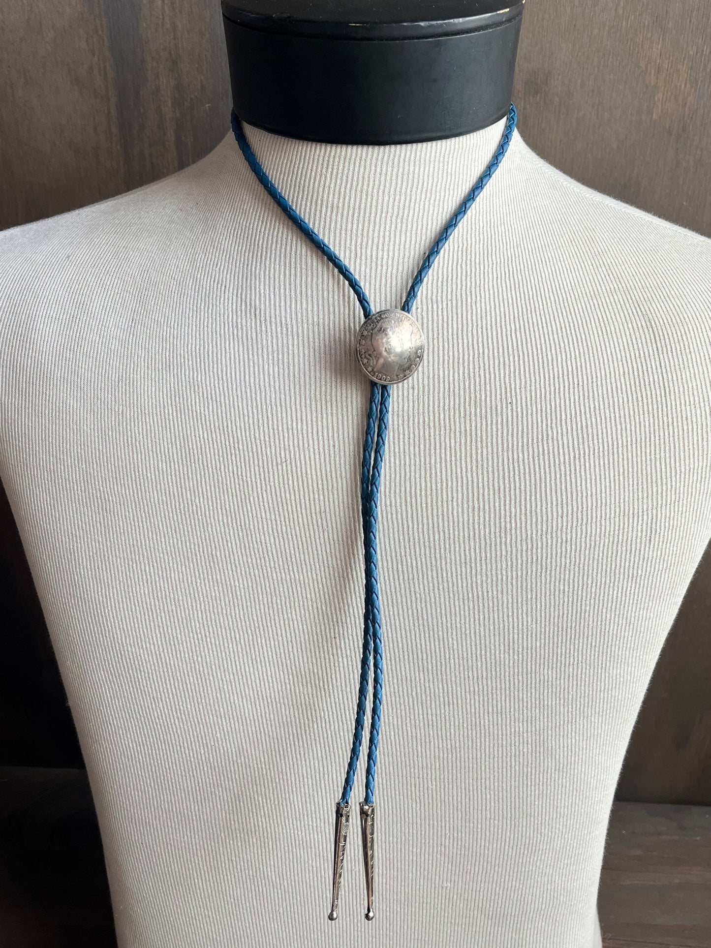 1909 Silver Dollar Bolo on Blue Tie