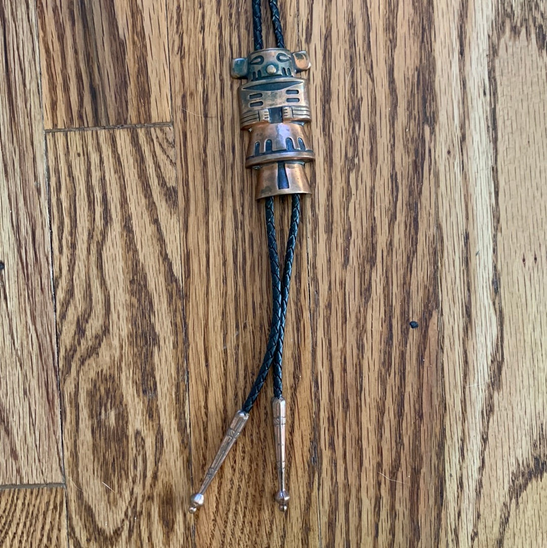 Metal Kachina bolo with black leather tie