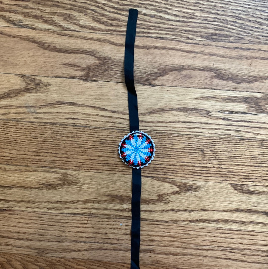 Seed bead medallion on black ribbon