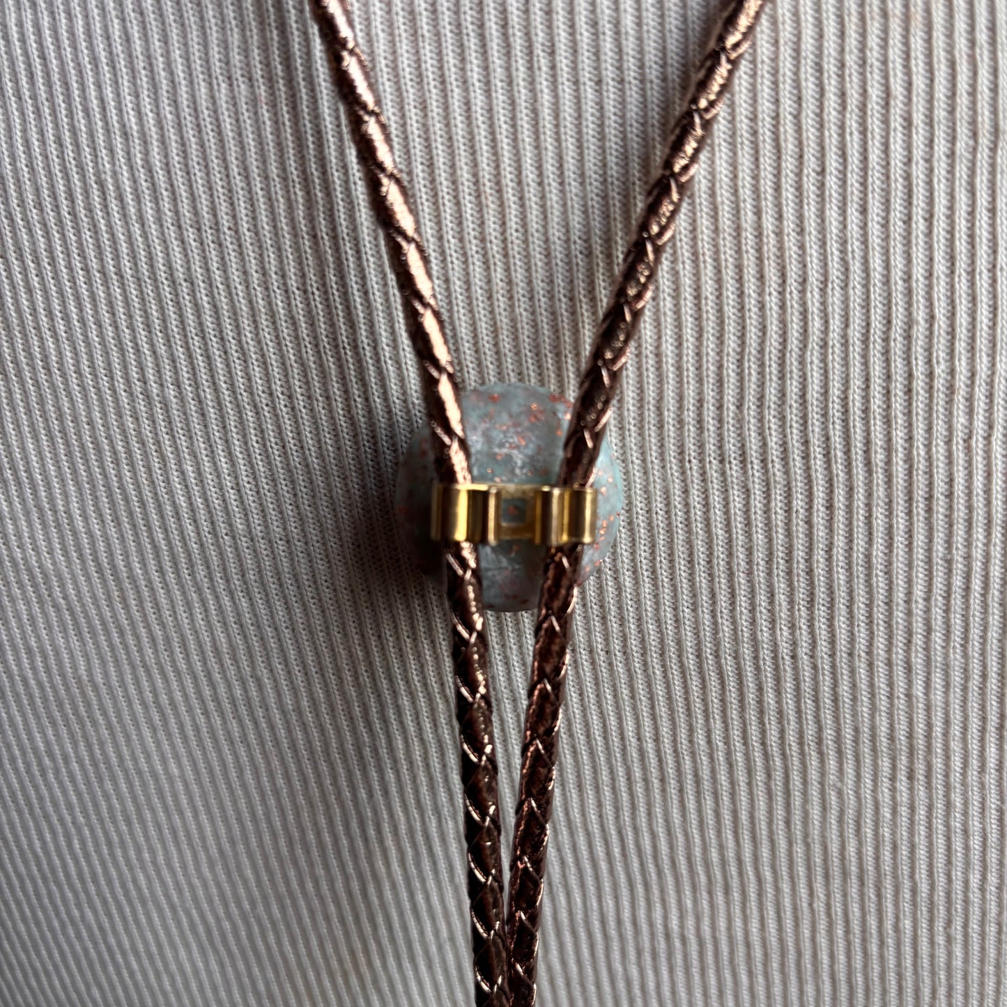 Light Blue Circle Bolo on Gold Leather Tie