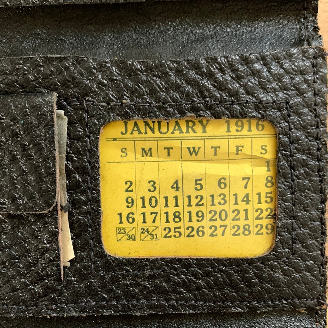 Antique leather wallet with 1916 monthly calendar