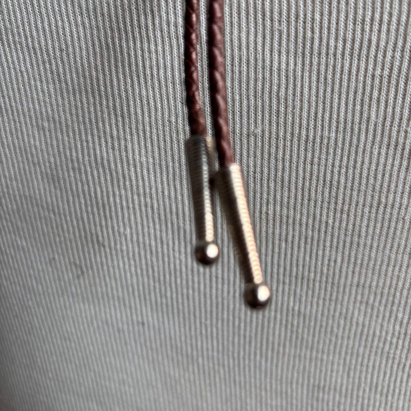 Brown Polished Stone Bolo on Brown Tie