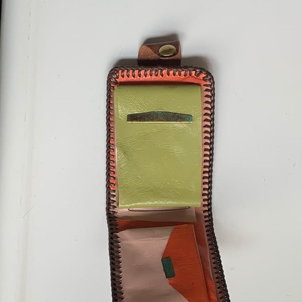 Tooled leather wallet with colorful insert