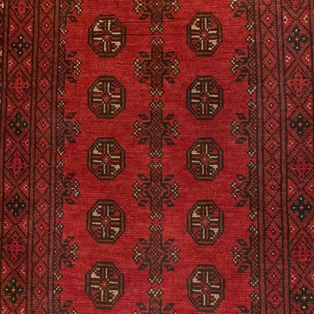 Dark red, black & cream area rug