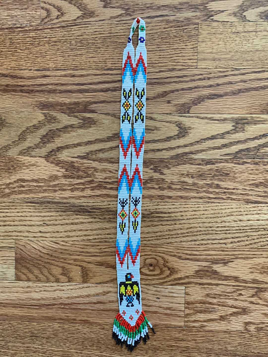 Multi-color beaded bird necklace with fringe