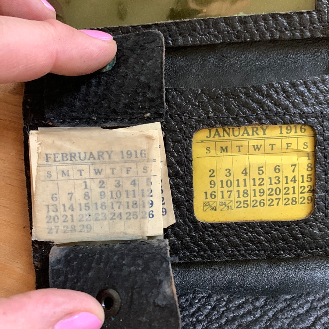 Antique leather wallet with 1916 monthly calendar