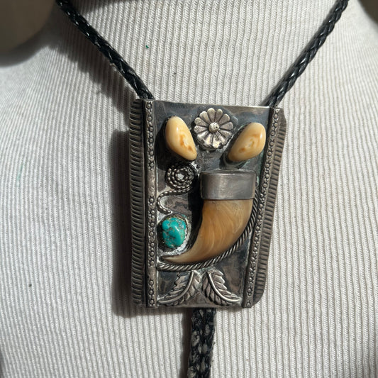 Sterling silver bear claw bolo with black tie