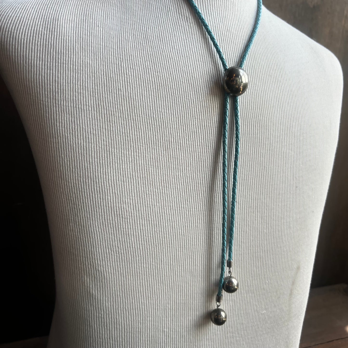 Silver Circle Bolo on Blue Cord