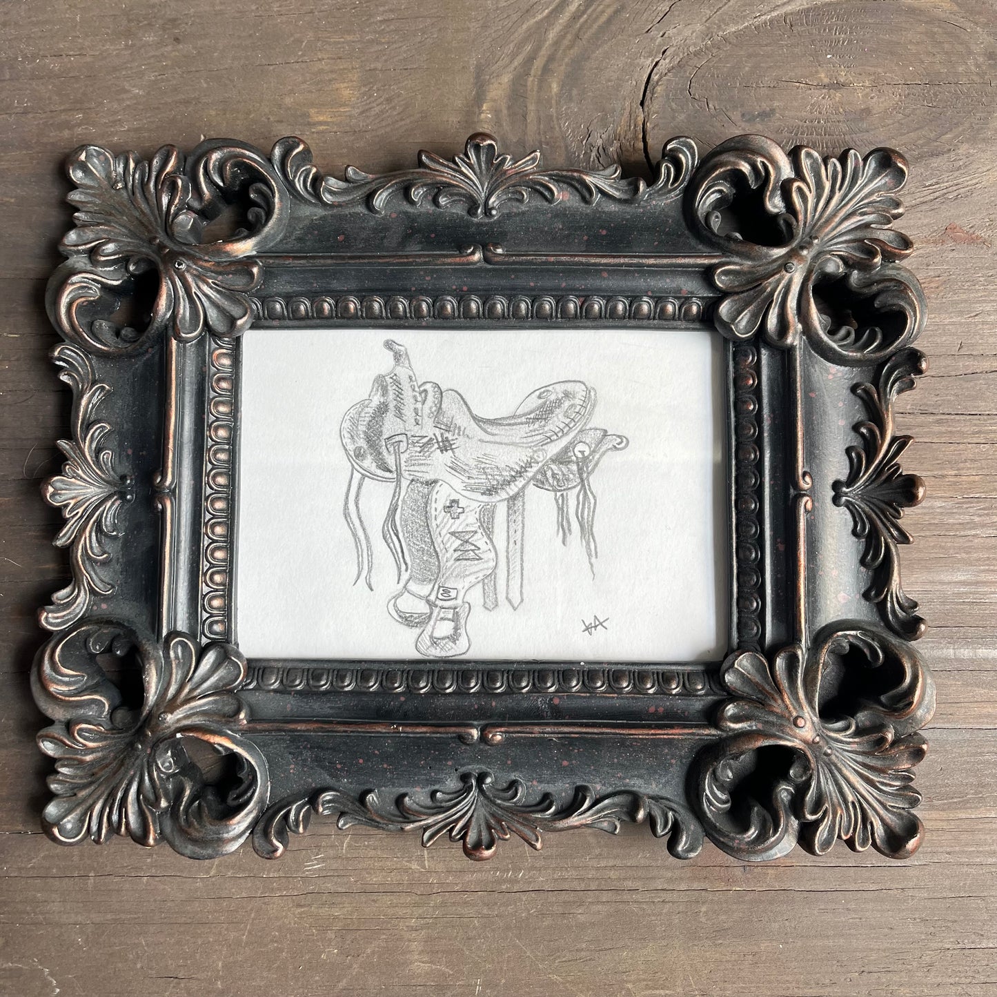 Saddle artwork in ornate frame
