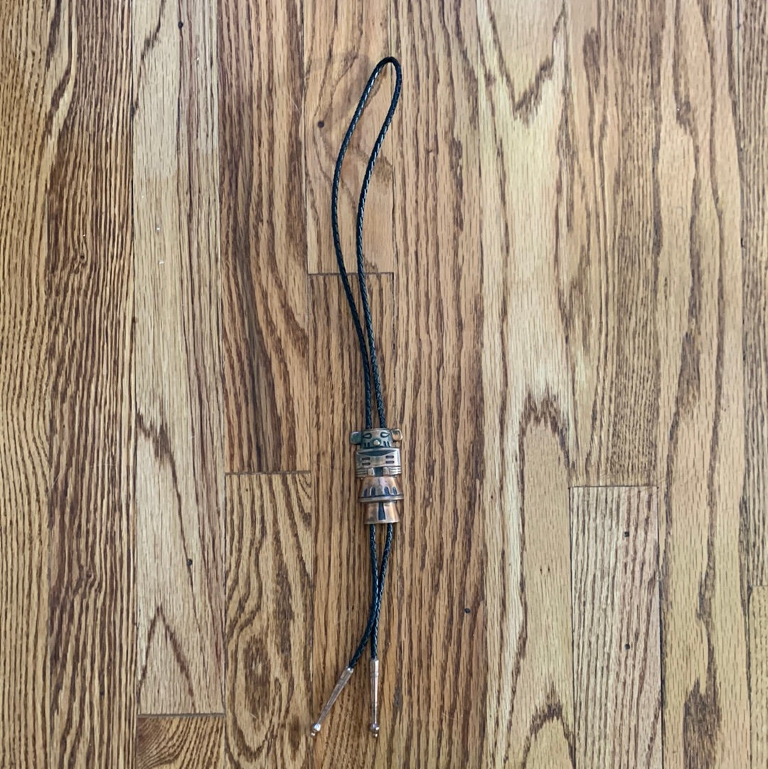 Metal Kachina bolo with black leather tie