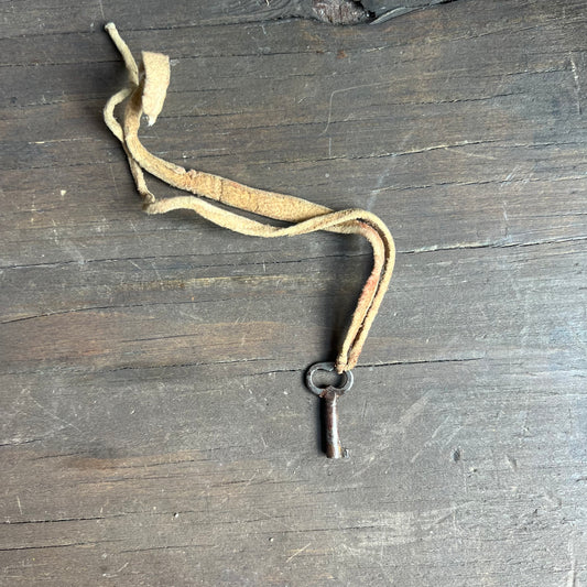 Silver Key Pendant on Leather Tie