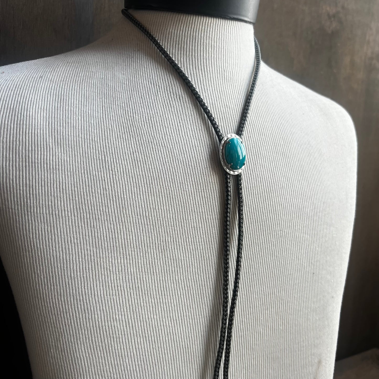 Faux Turquoise Bolo Tie on Black and White Cord
