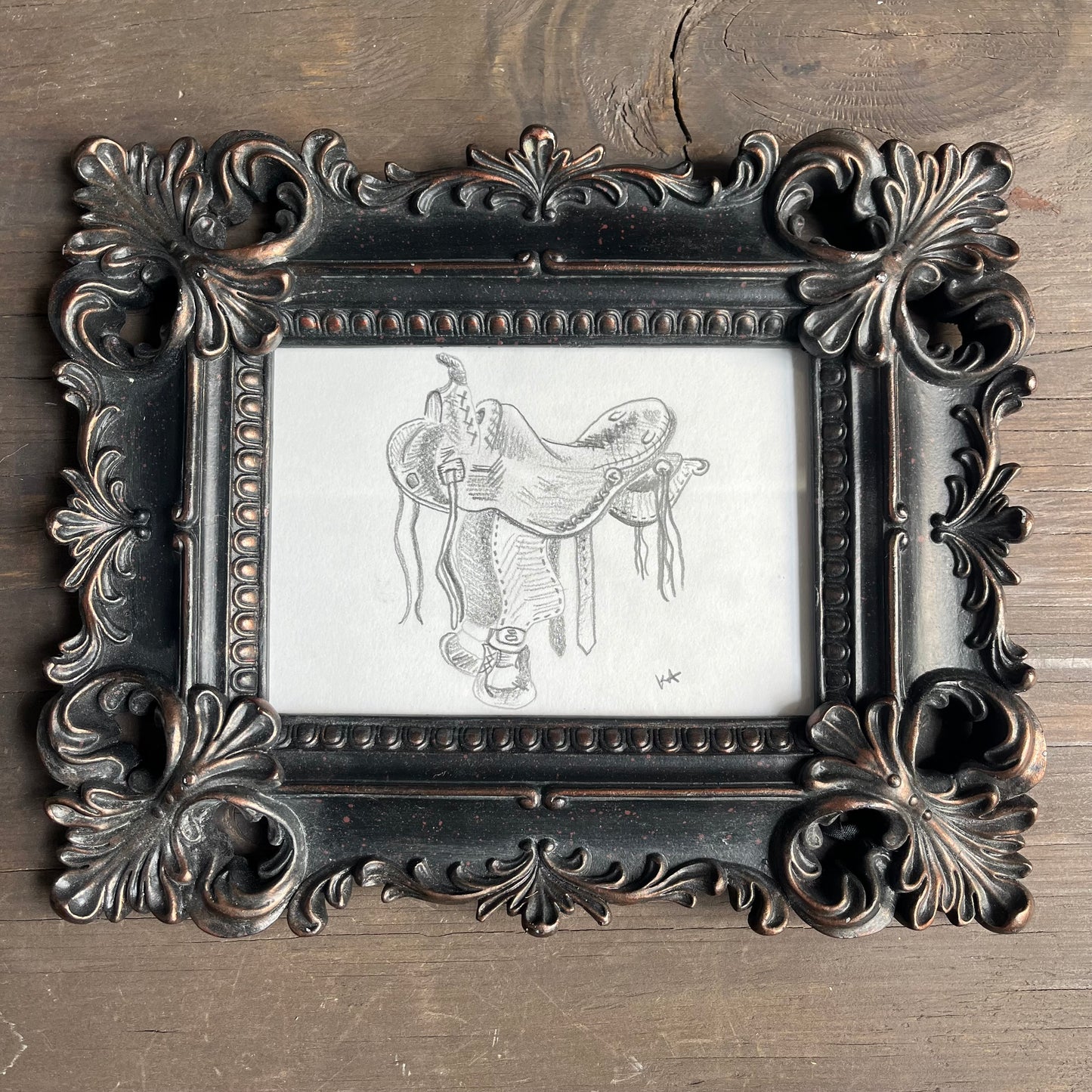 Saddle artwork in ornate frame