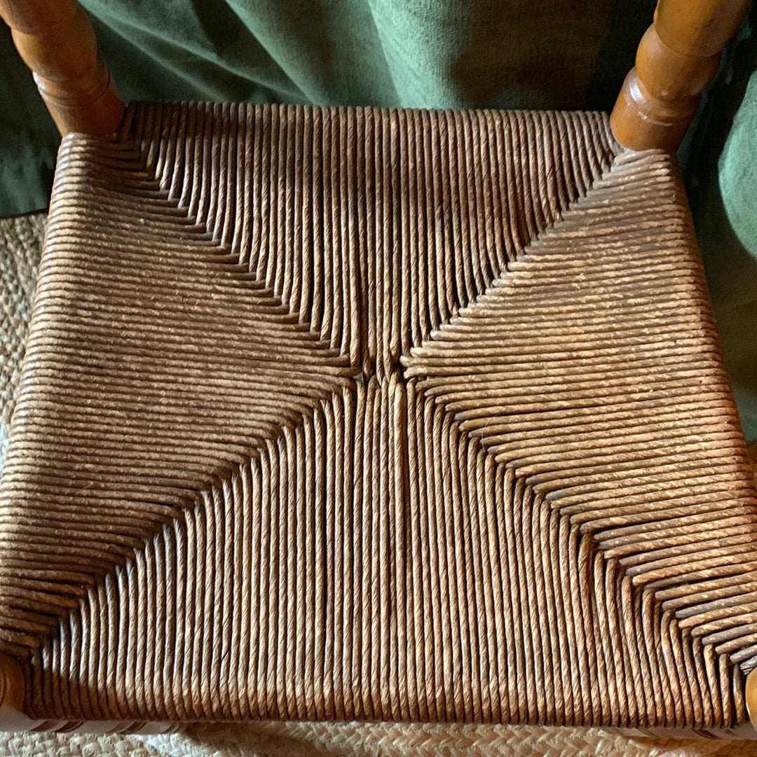 Vintage carved wood chair with wicker seat