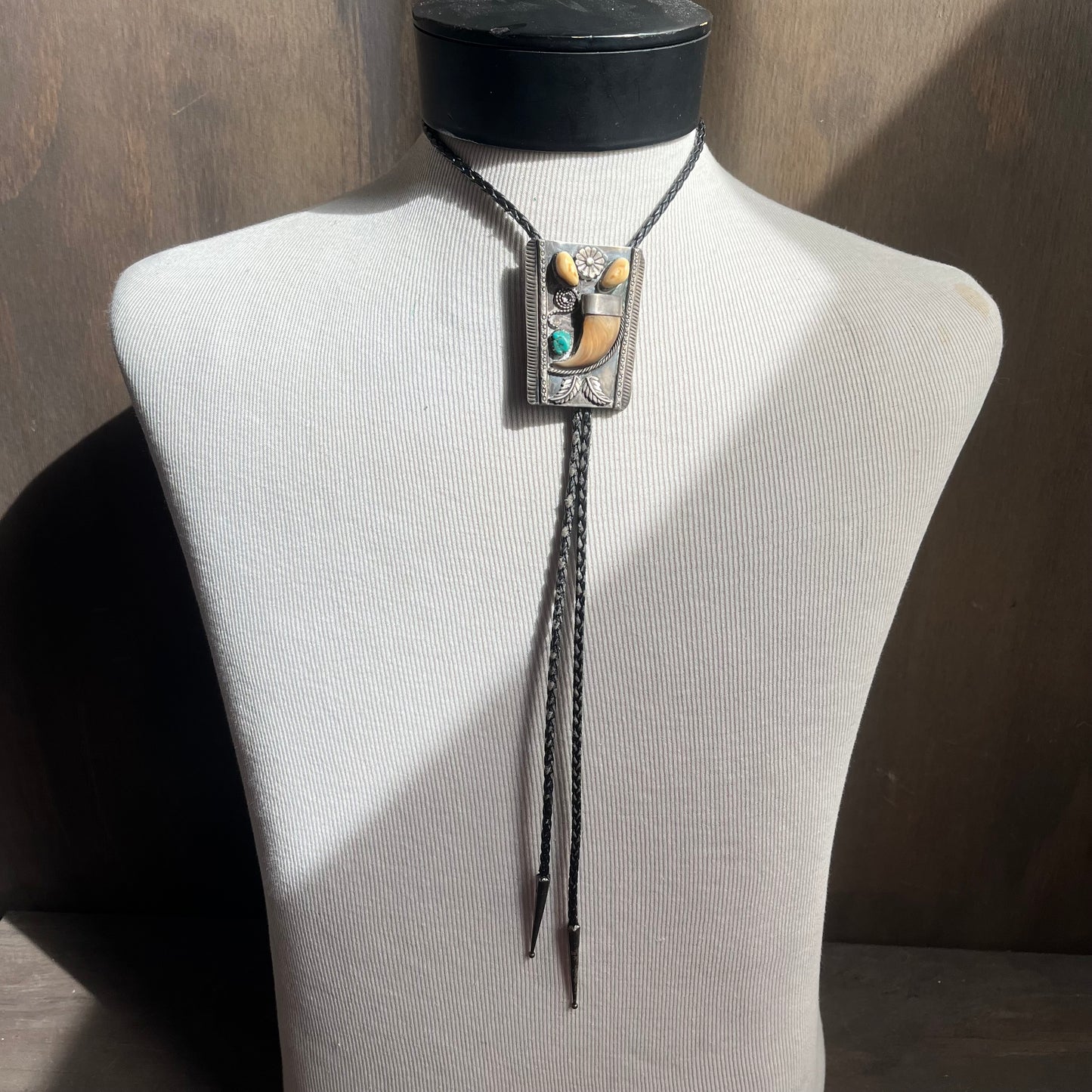 Sterling silver bear claw bolo with black tie