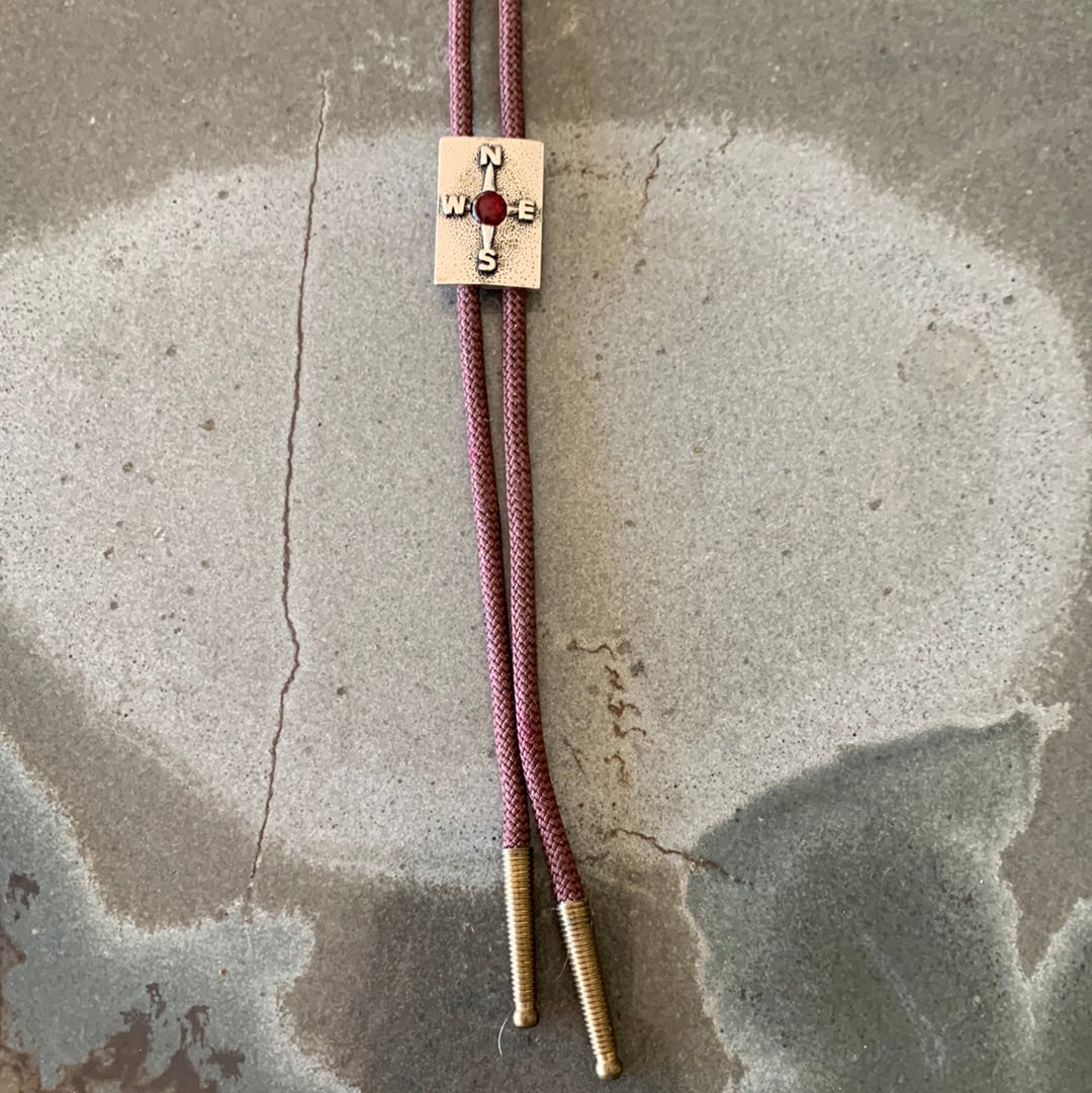 Silver compass with brown cord
