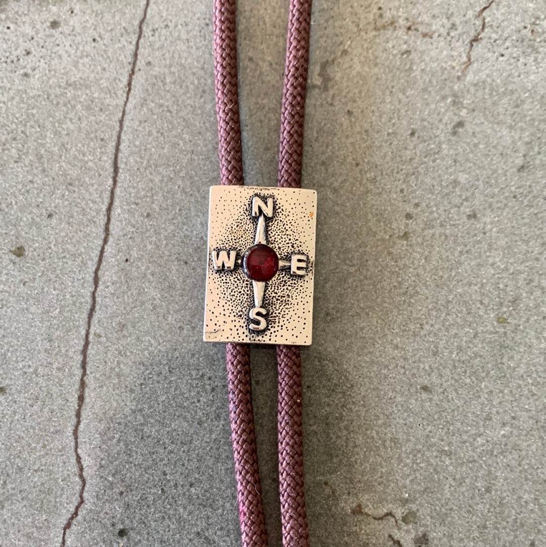 Silver compass with brown cord