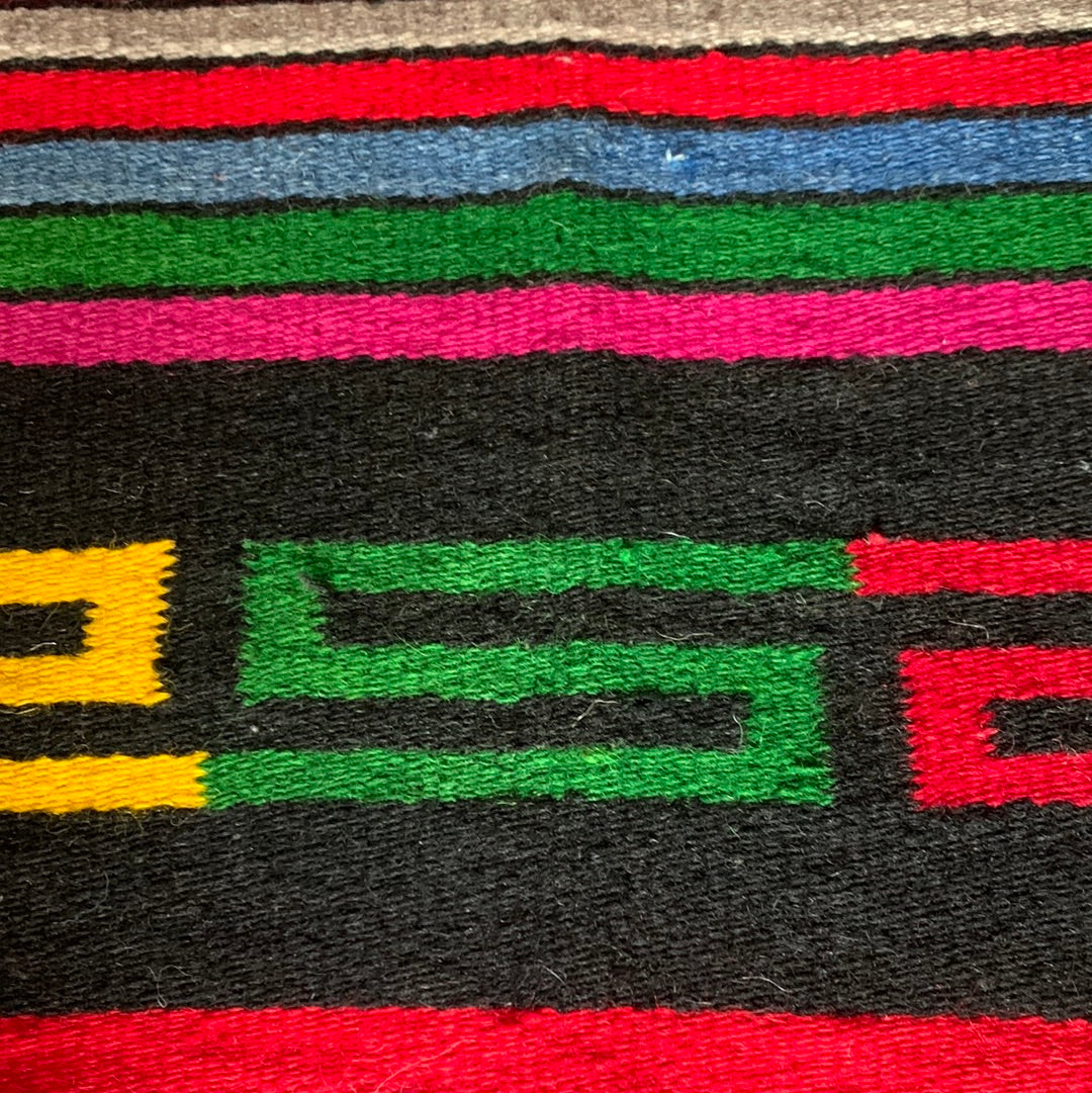 Striped woven throw with fringe
