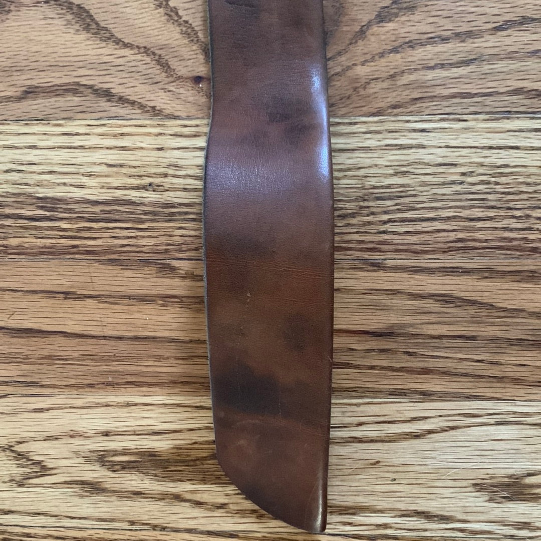 Wide leather belt with circular buckle