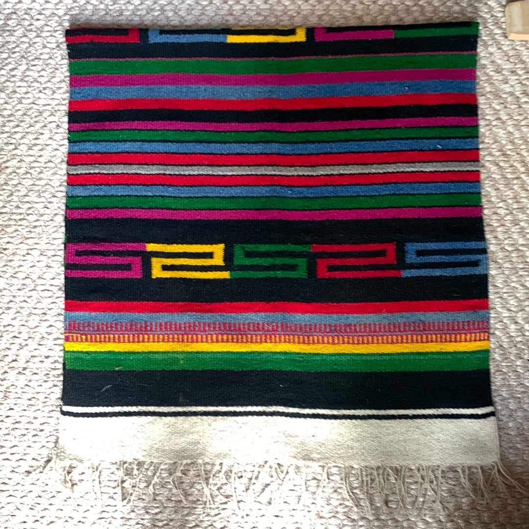 Striped woven throw with fringe