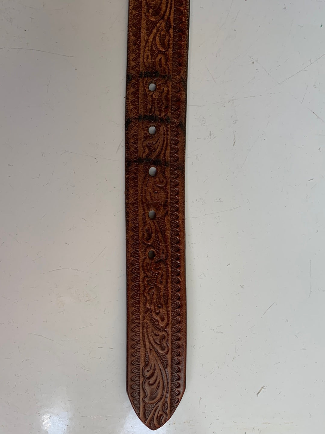 Leather belt with decorative etching