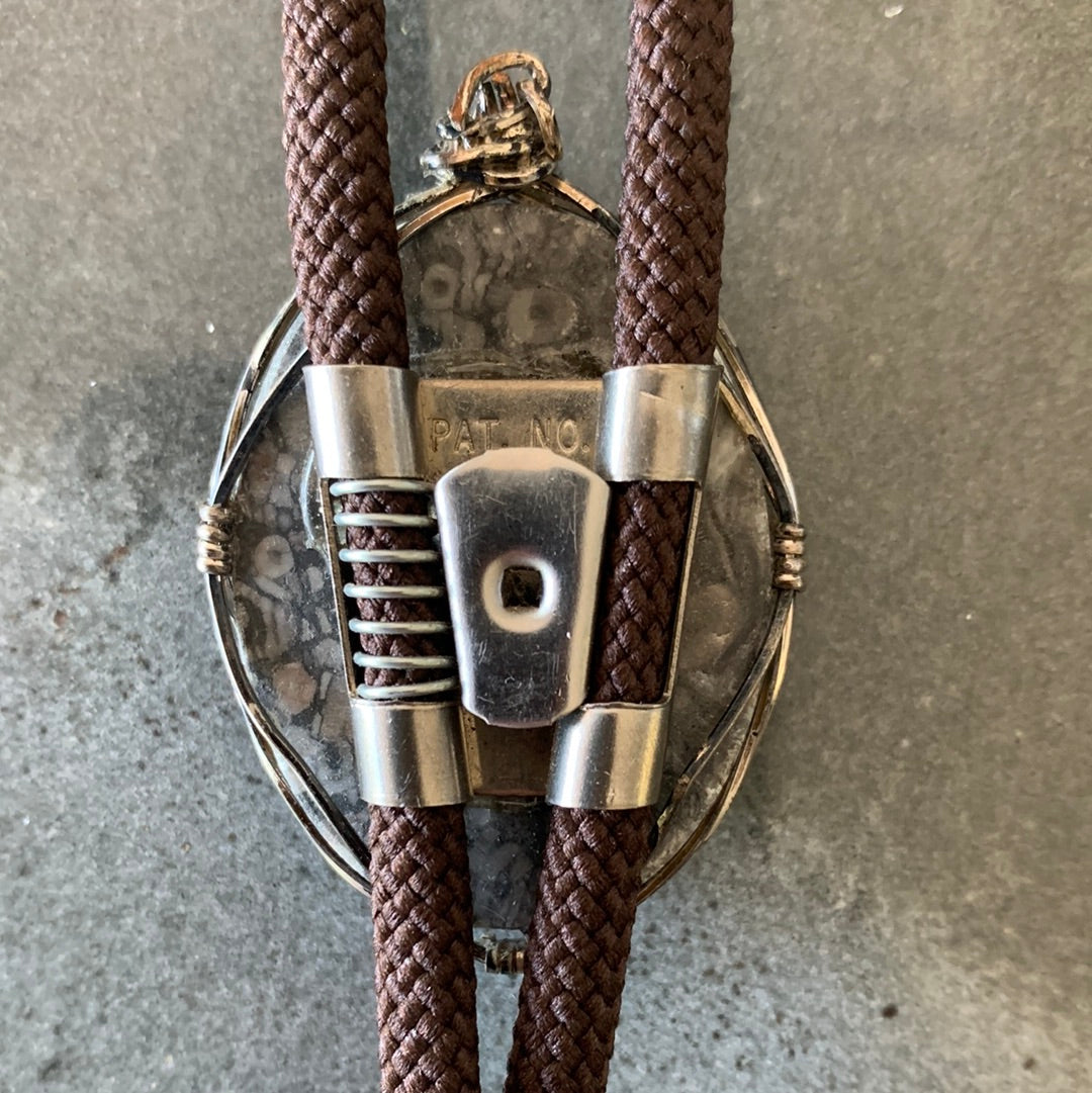 Grey silver wrapped stone bolo with brown cord