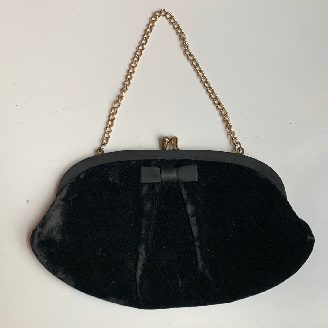 Black velvet purse with gold chain strap bow