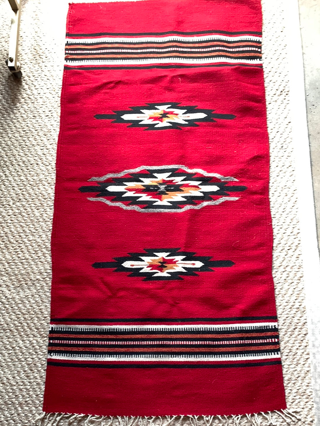Red, black & cream woven rug with fringe