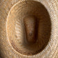 Straw cowboy hat with brown studded band