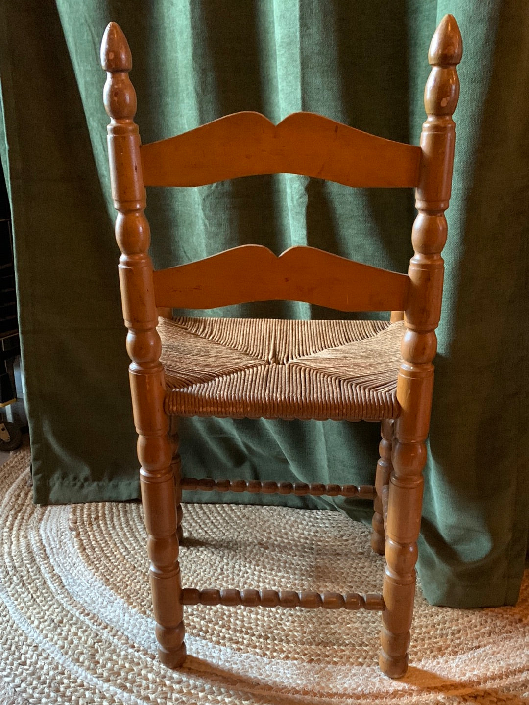 Vintage carved wood chair with wicker seat