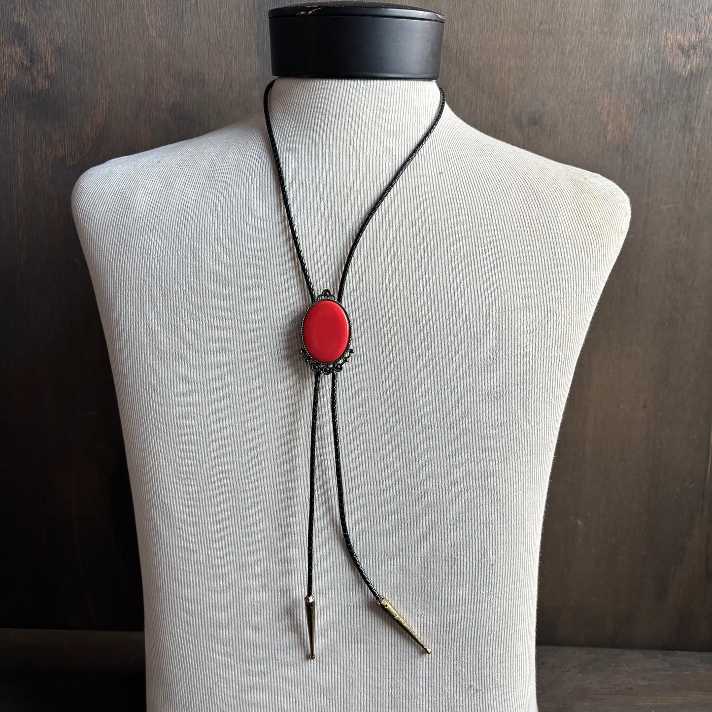 Red Oval Stone Bolo on Black Tie
