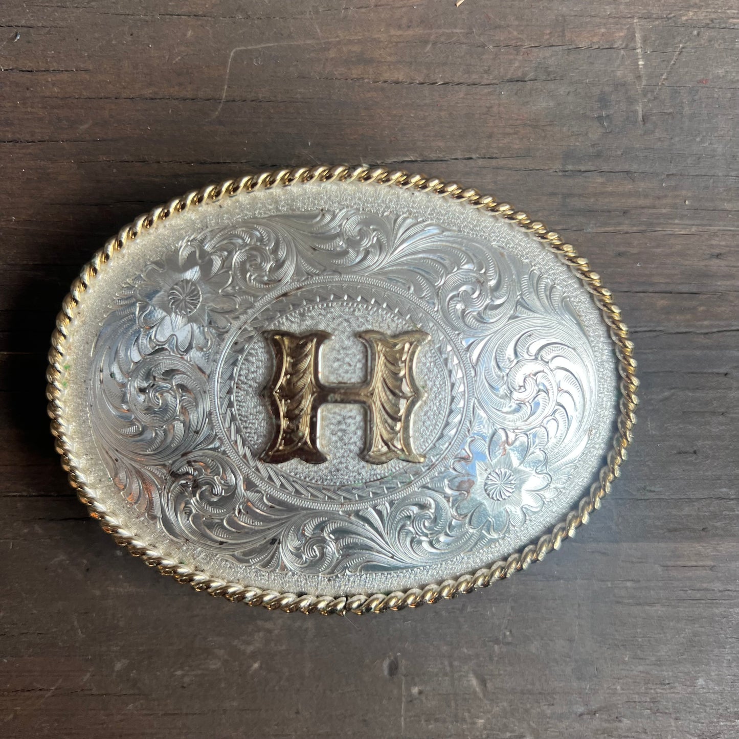 Silver Belt Buckle with Gold “H”