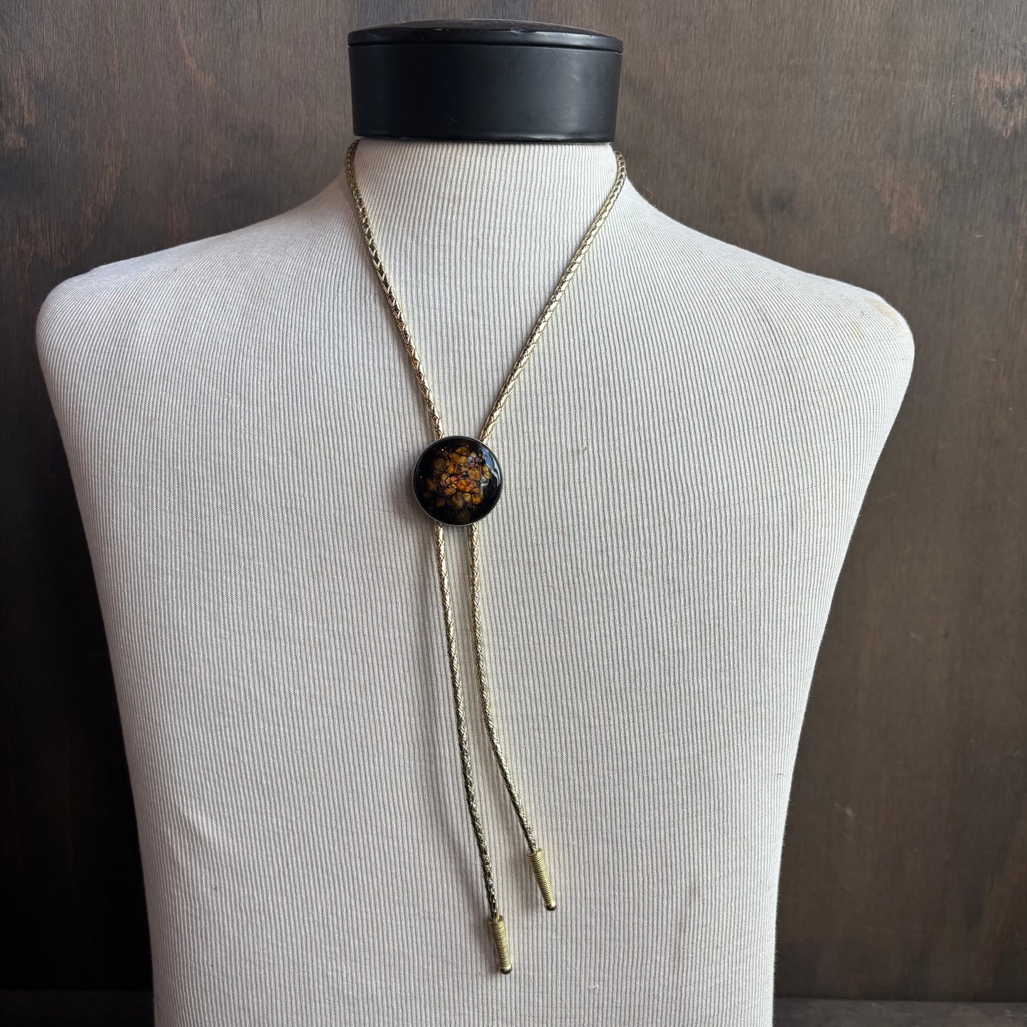 Round Enamel Bolo on Gold Tie
