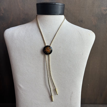 Round Enamel Bolo on Gold Tie