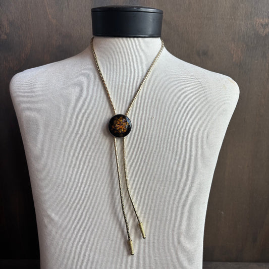 Round Enamel Bolo on Gold Tie