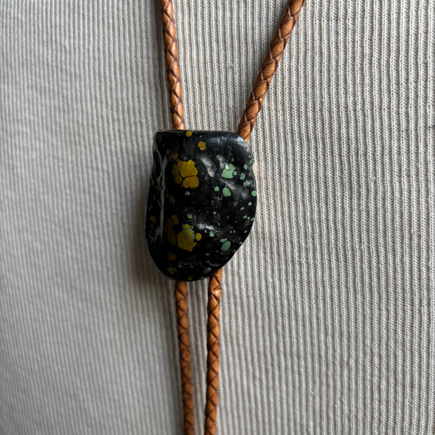 Speckled Stone Bolo on Tan Leather Tie