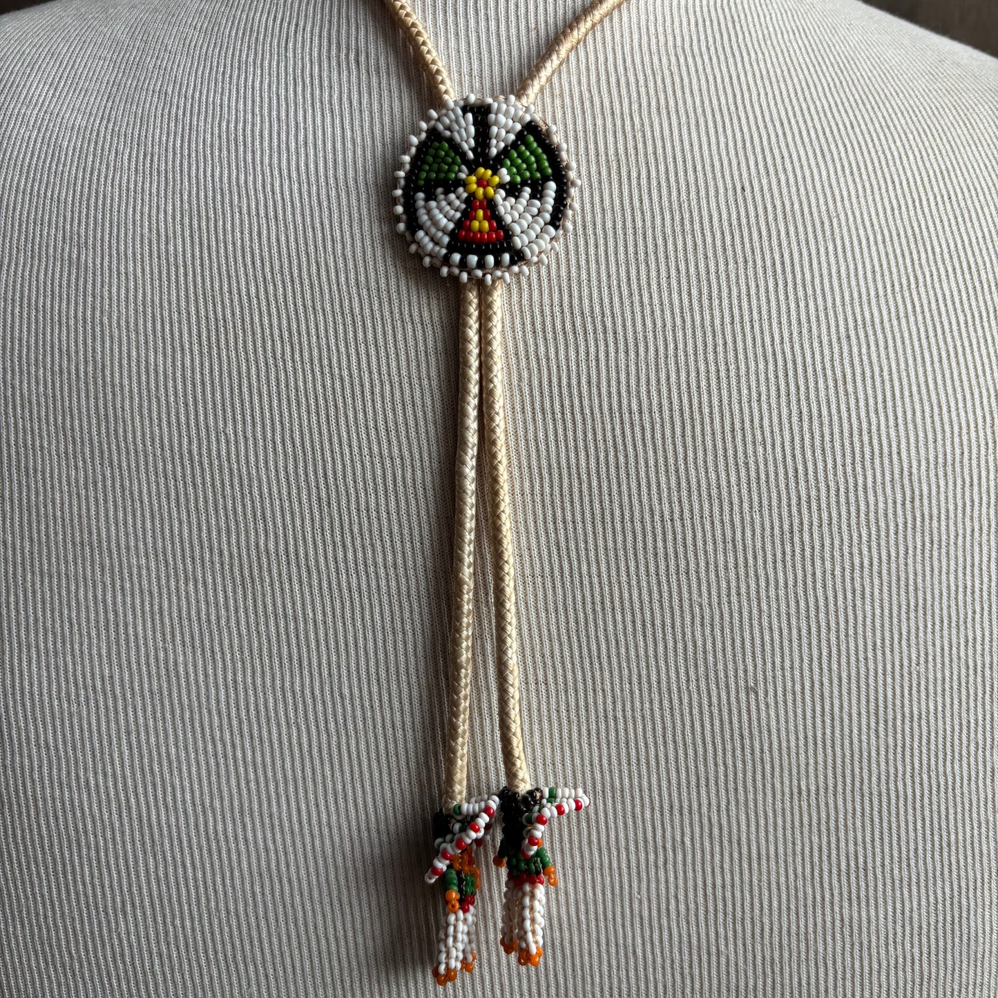 Seed Bead Thunderbird Bolo on Cream Tie