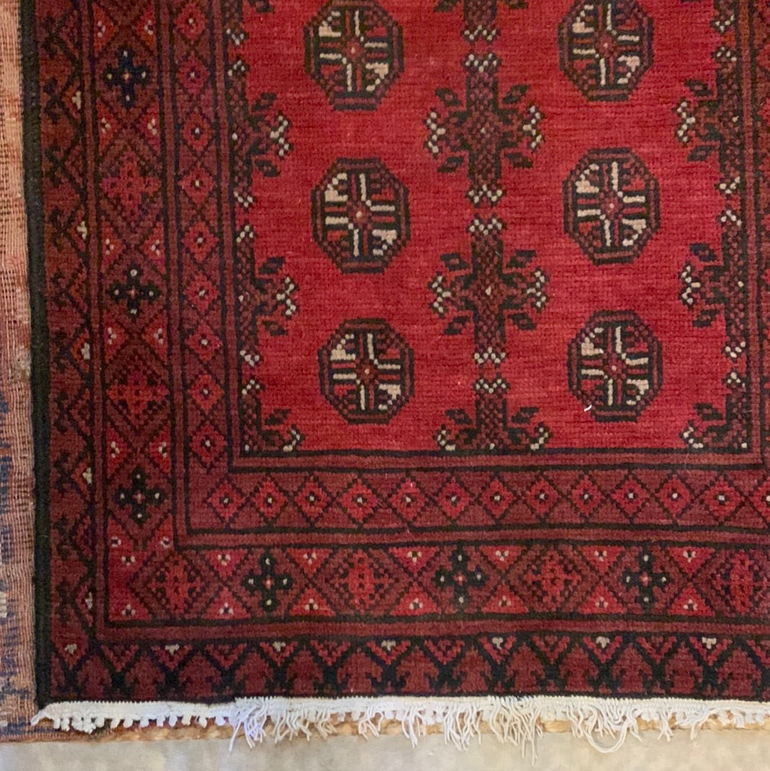 Dark red, black & cream area rug