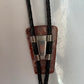 Polished red stone bolo with black leather tie