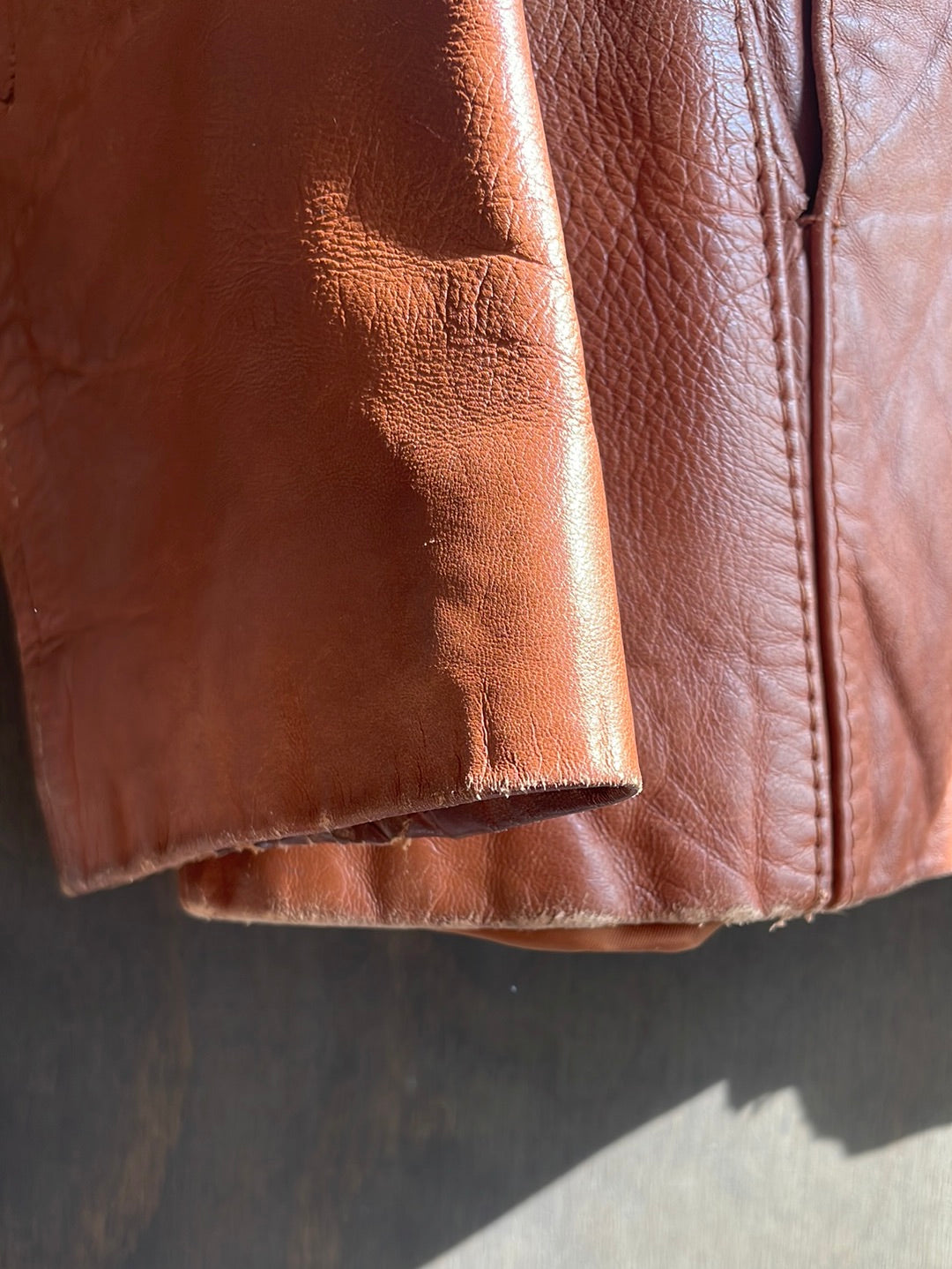 Brown Leather Jacket with Woven Details